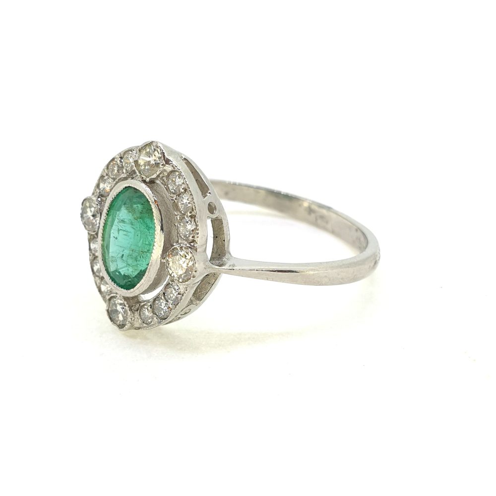 Oval Emerald and Diamond Cluster Ring in Platinum