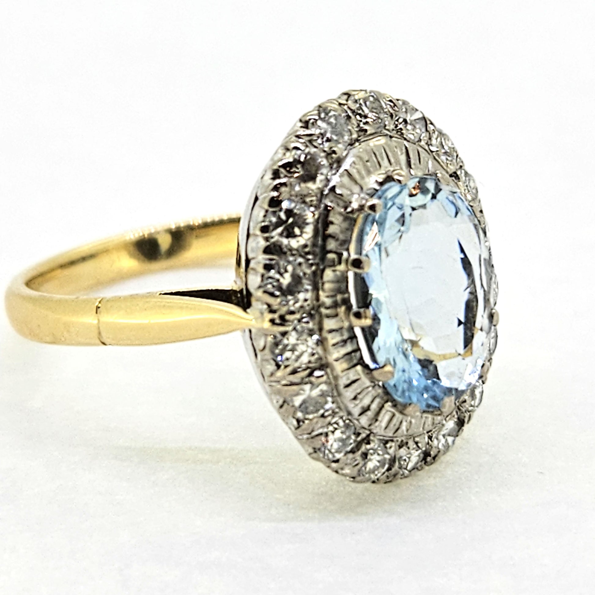 2.60ct Oval Aquamarine and Diamond Cluster Engagement Ring