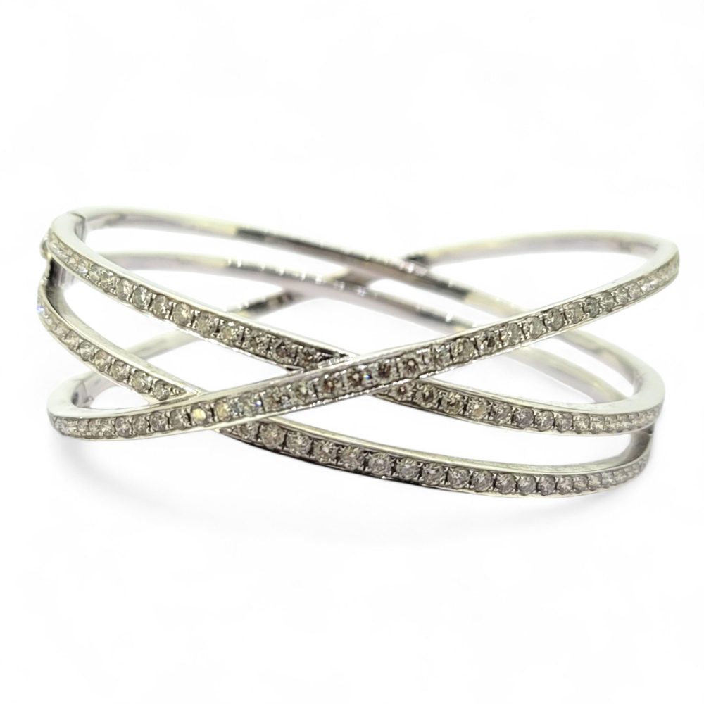 3.49ct Diamond Set 18ct White Gold Bangle Bracelet, 18ct white gold bangle composed of three criss-cross sections set with 3.49 carats of sparkling diamonds