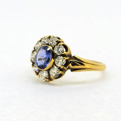 Antique Style Oval Sapphire and Diamond Cluster Engagement Ring, 0.80ct oval sapphire surrounded by 0.80cts sparkling diamonds in 18ct yellow gold with detailed shoulders