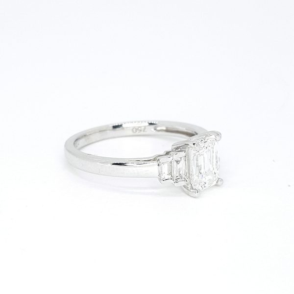 Emerald Cut Diamond Engagement Ring, central GIA certified 1.01 carat emerald-cut diamond flanked by graduated baguette-cut diamonds, in 18ct white gold, colour E clarity VS1