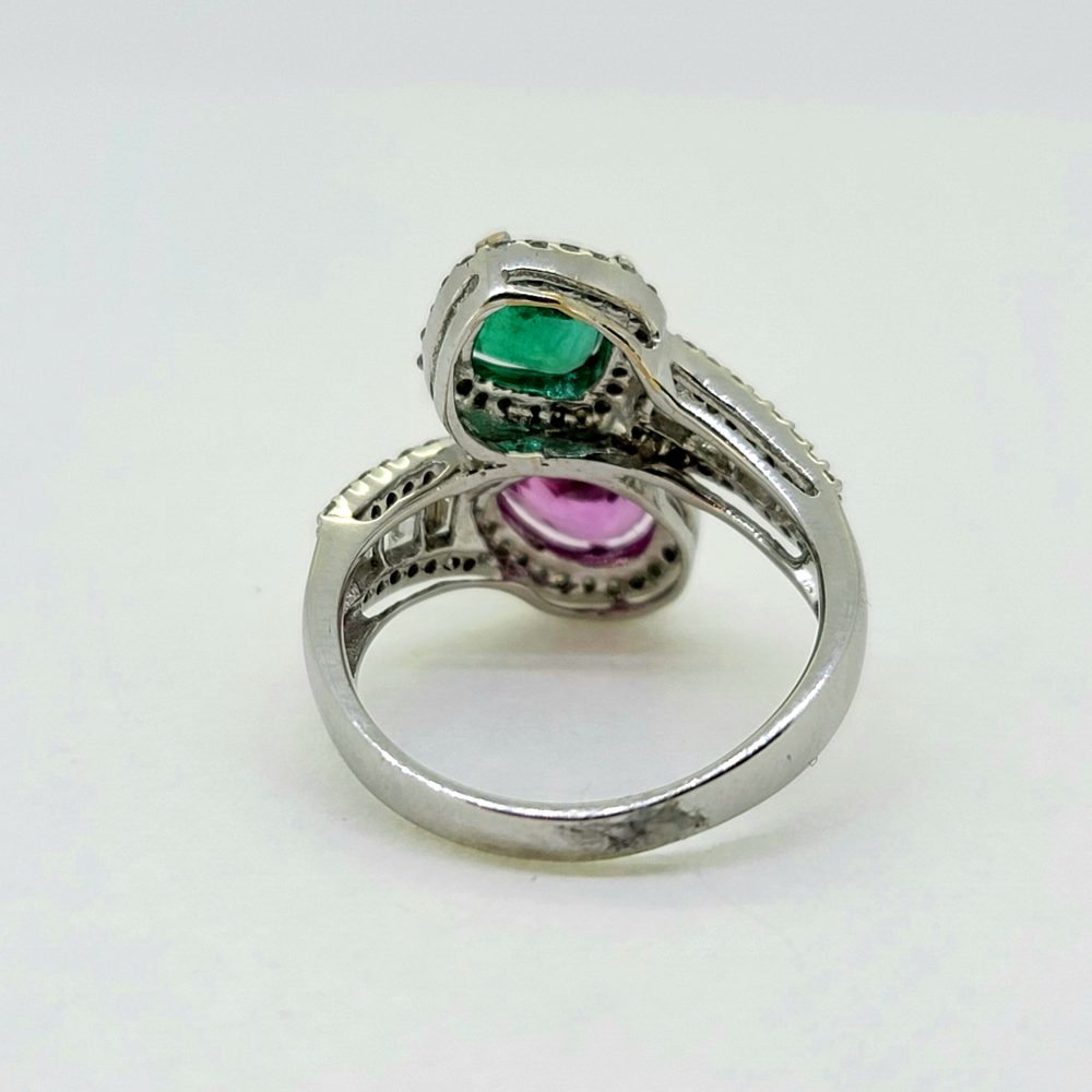 Contemporary 1.04ct Pear Cut Pink Sapphire 0.85ct Emerald and 0.77ct Diamond Cluster Toi et Moi Two Stone Crossover Ring in 18ct White Gold
