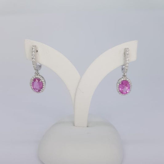 Pink Sapphire and Diamond Cluster Drop Earrings; featuring 2.01ct oval pink sapphires within diamond surrounds and suspended from diamond-set drops, in 18ct white gold