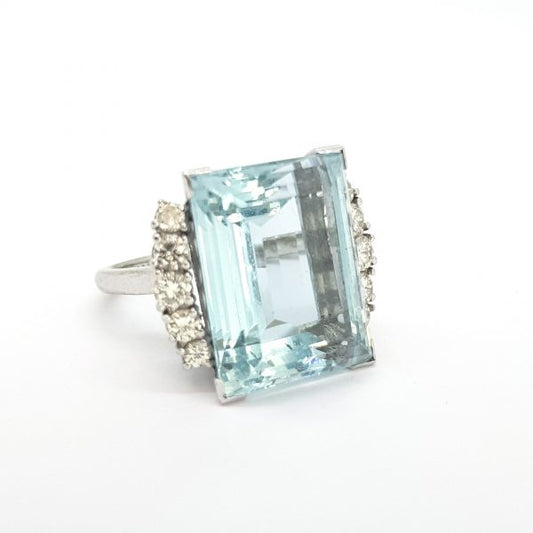 Aquamarine and Diamond Cocktail Ring; large 14 carat rectangular step-cut aquamarine flanked by 1cts diamonds, in 18ct white gold