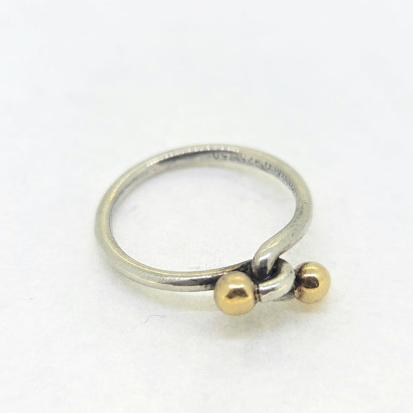 Pre Loved Tiffany and Co Silver Twisted Knot Ring, composed of a twist top leading to two golden balls