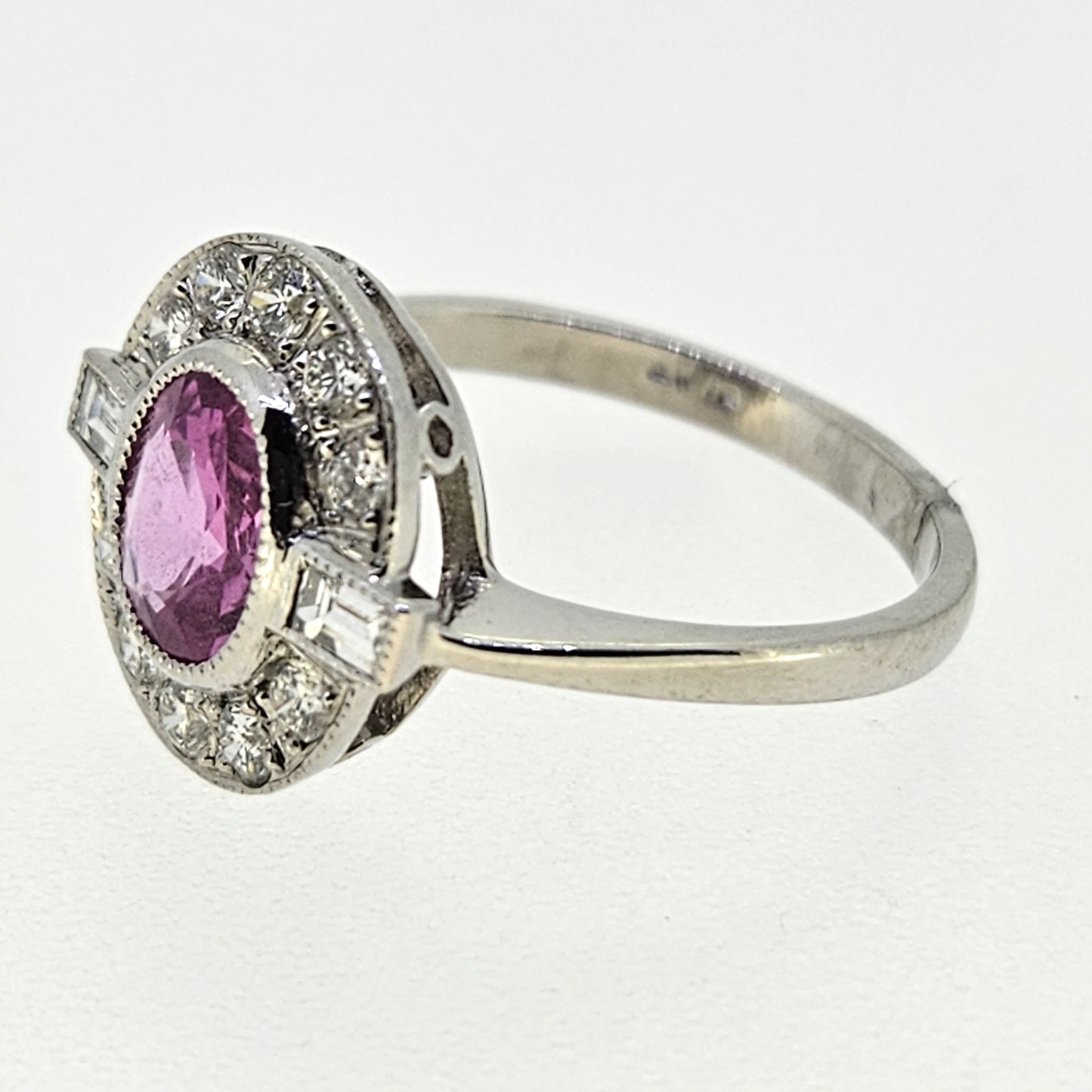 1.20ct oval pink sapphire ring with diamonds in platinum