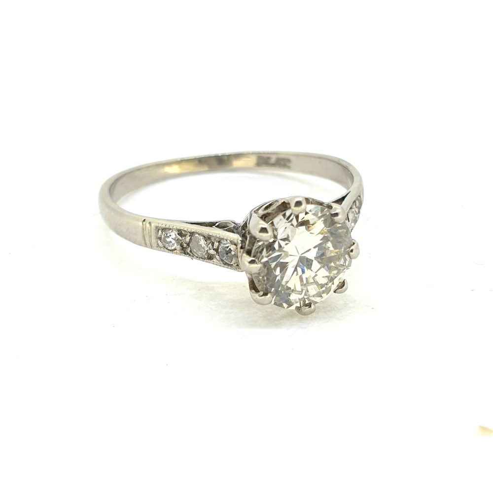 Timeless Single Stone 1.30ct Diamond Solitaire Engagement Ring in Platinum with diamond-set shoulders