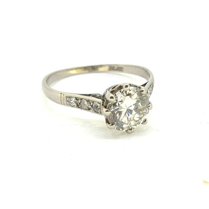 Timeless Single Stone 1.30ct Diamond Solitaire Engagement Ring in Platinum with diamond-set shoulders