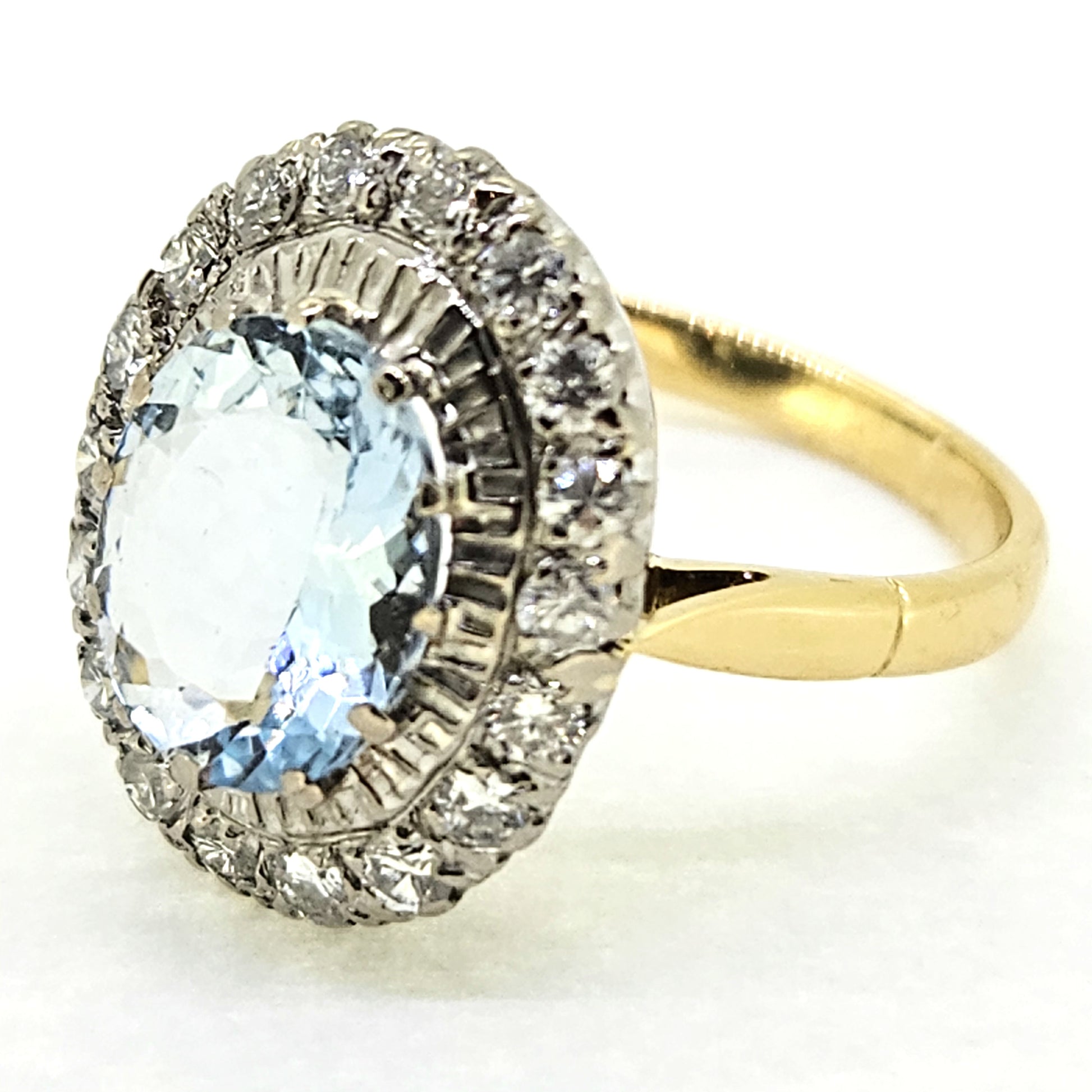 2.60ct Oval Aquamarine and Diamond Cluster Engagement Ring