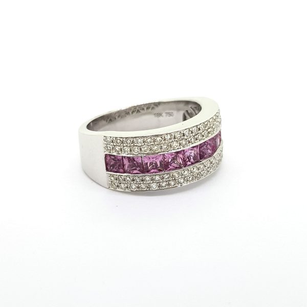 Princess Cut Pink Sapphire and Diamond Set Band Ring; central row of princess-cut pink sapphires flanked top and bottom by two rows of brilliant-cut diamonds, in 18ct white gold