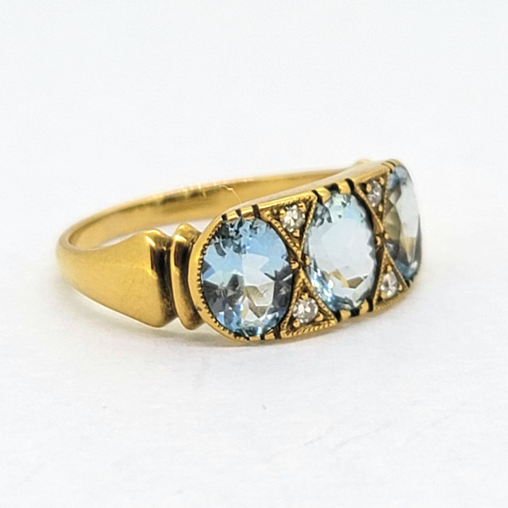 Aquamarine Three Stone Ring in 18ct Yellow Gold with Diamond Accents