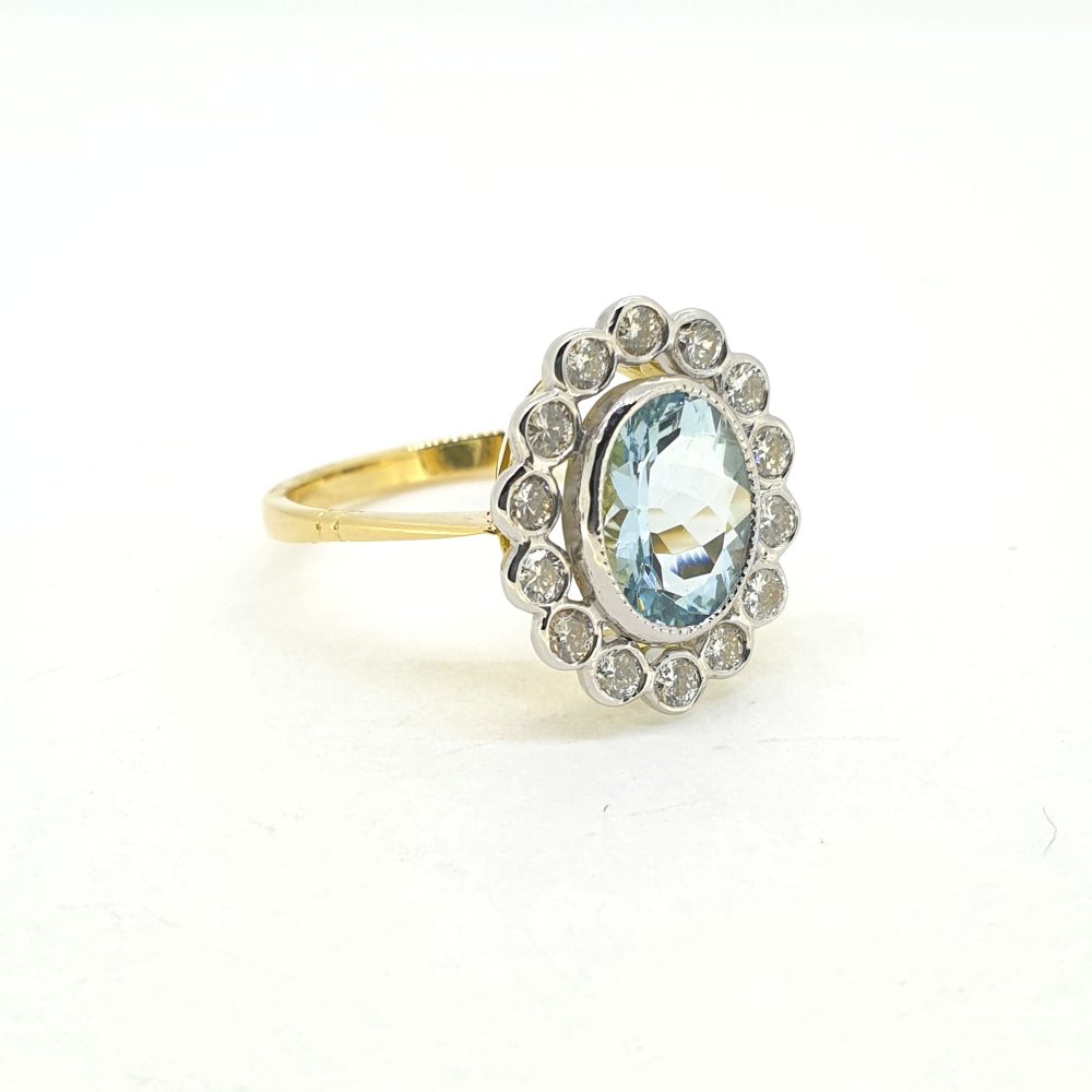 1.40ct Oval Aquamarine and Diamond Cluster Ring