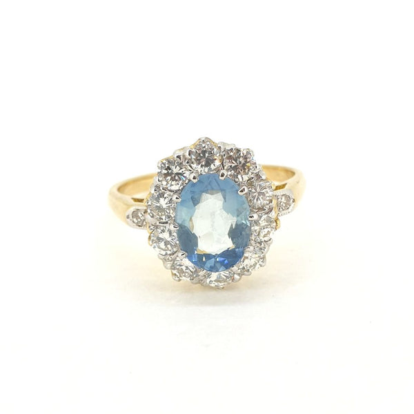 0.80ct Oval Aquamarine and Diamond Cluster Engagement Ring in 18ct Yellow Gold