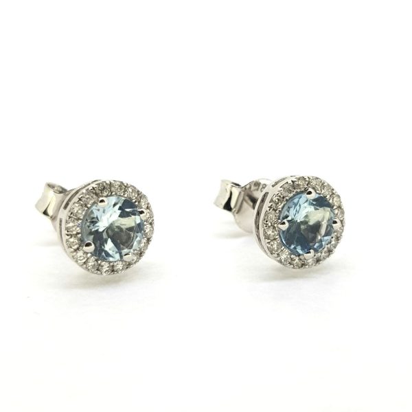Aquamarine and Diamond Cluster Stud Earrings; central 0.85ct aquamarines within 0.17cts diamond borders, in 18ct white gold