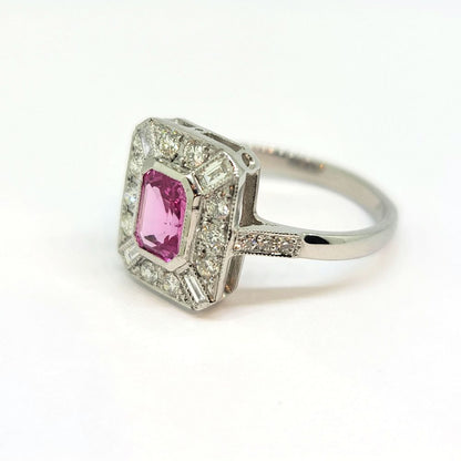 1ct Pink Sapphire and Diamond Cluster Dress Ring in Platinum, emerald-cut pink sapphire within brilliant-cut diamond surround accented with baguette-cut diamond to each corner
