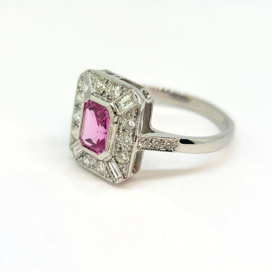 1ct Pink Sapphire and Diamond Cluster Dress Ring in Platinum, emerald-cut pink sapphire within brilliant-cut diamond surround accented with baguette-cut diamond to each corner