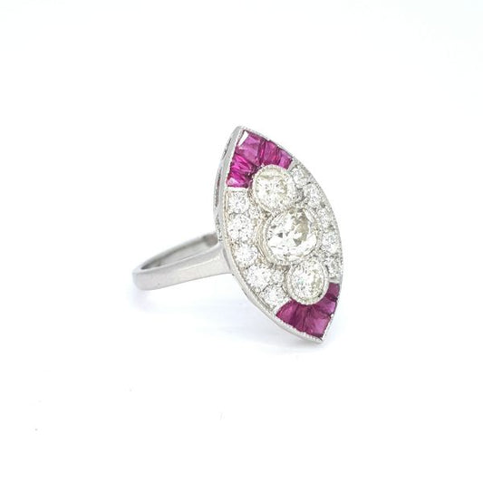 Ruby and Diamond Marquise Shaped Navette Cluster Ring in Platinum; three central diamonds within a diamond surrounded accented with calibre-cut rubies to the tips