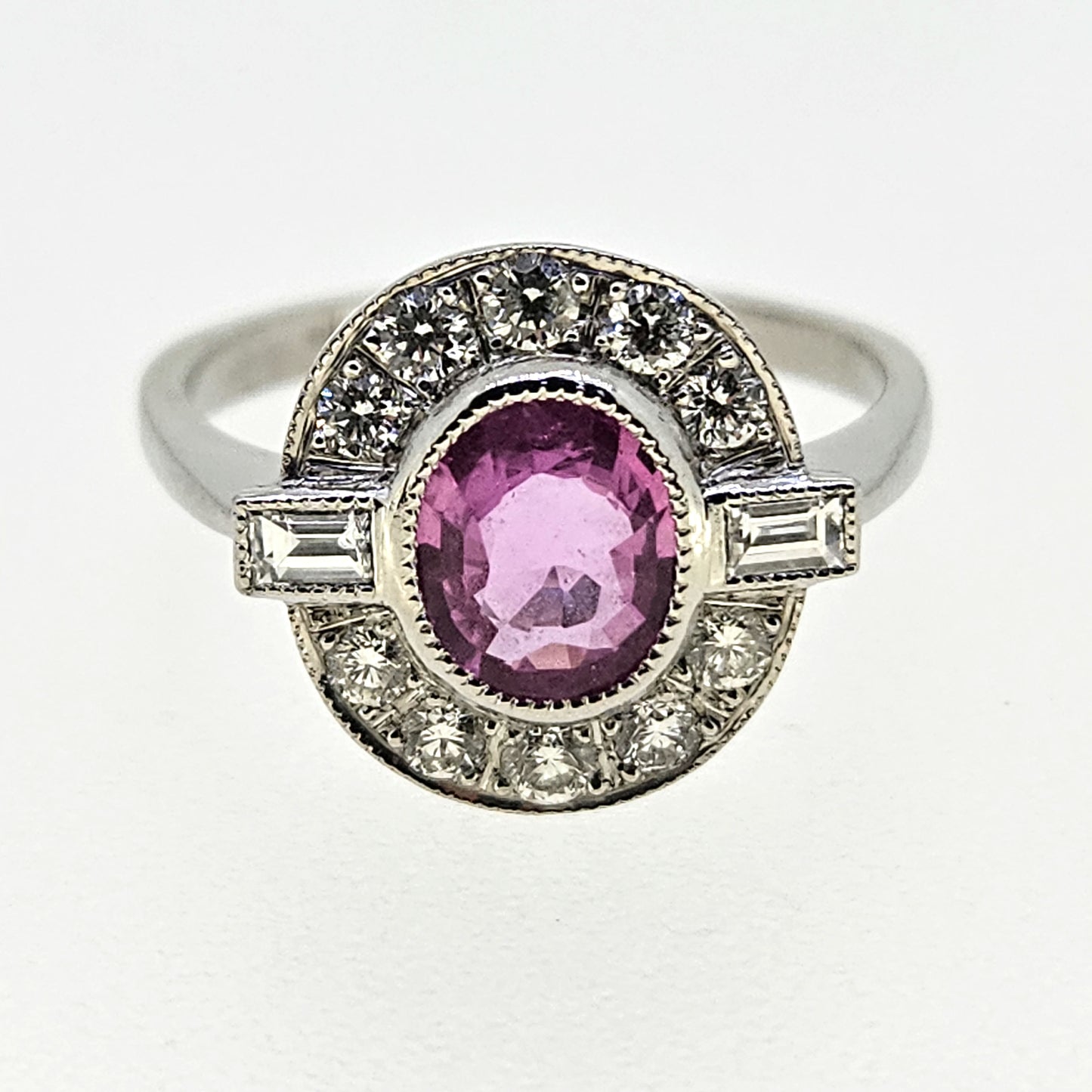 1.20ct oval pink sapphire ring with diamonds in platinum
