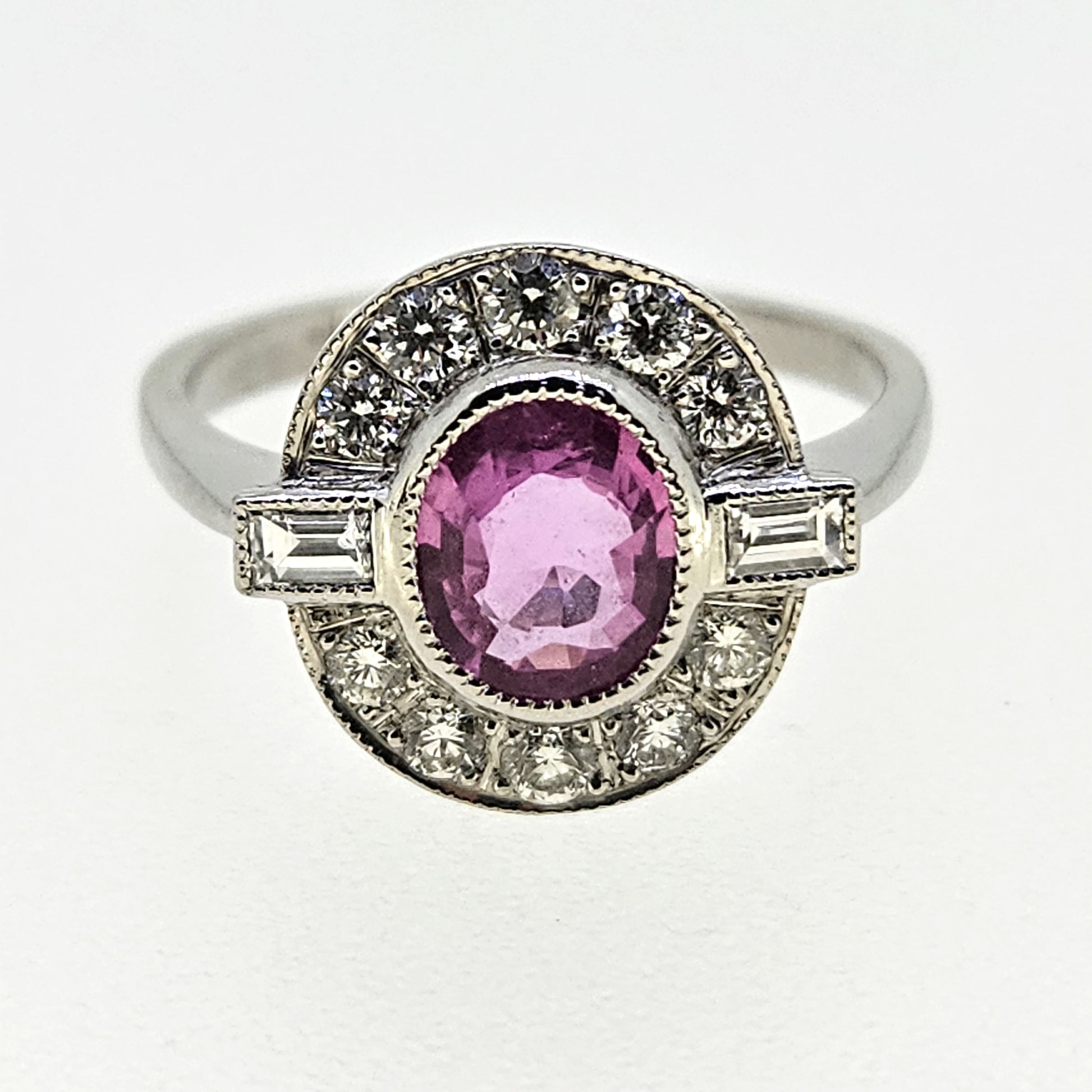1.20ct oval pink sapphire ring with diamonds in platinum