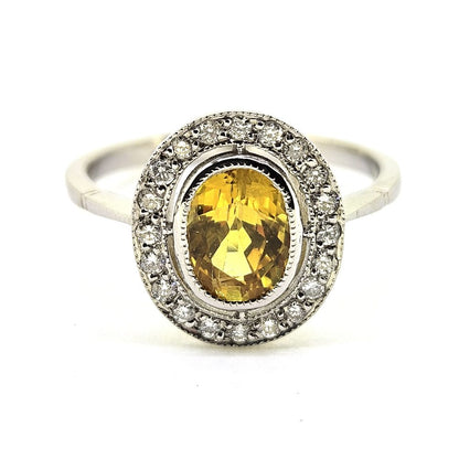 1.90ct Oval Yellow Sapphire and Diamond Halo Cluster Engagement Ring in Platinum