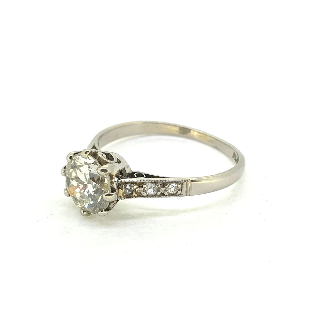 Timeless Single Stone 1.30ct Diamond Solitaire Engagement Ring in Platinum with diamond-set shoulders
