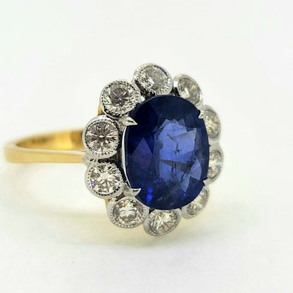 4.62ct Oval Sapphire and Diamond Cluster Engagement Ring