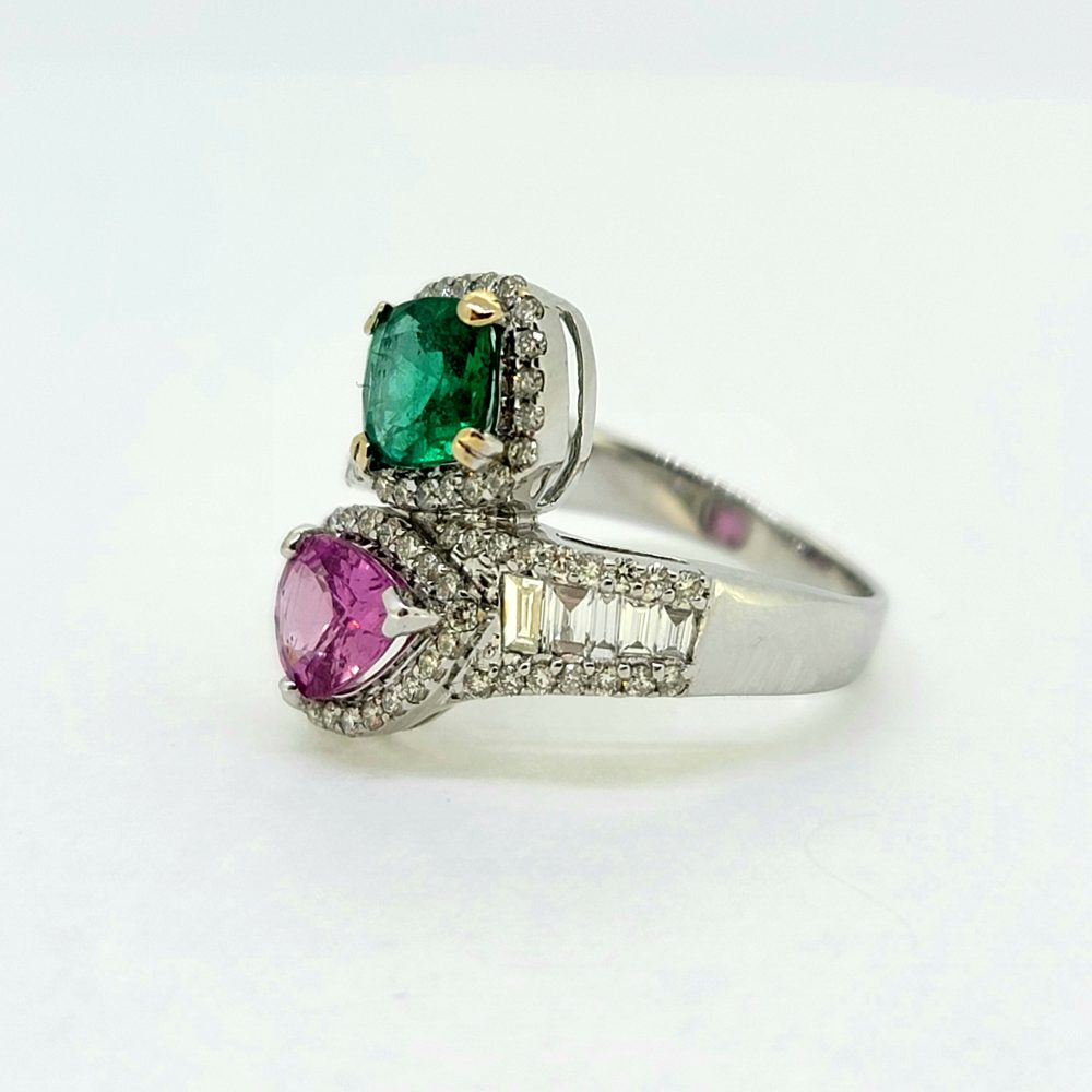 Contemporary 1.04ct Pear Cut Pink Sapphire 0.85ct Emerald and 0.77ct Diamond Cluster Toi et Moi Two Stone Crossover Ring in 18ct White Gold