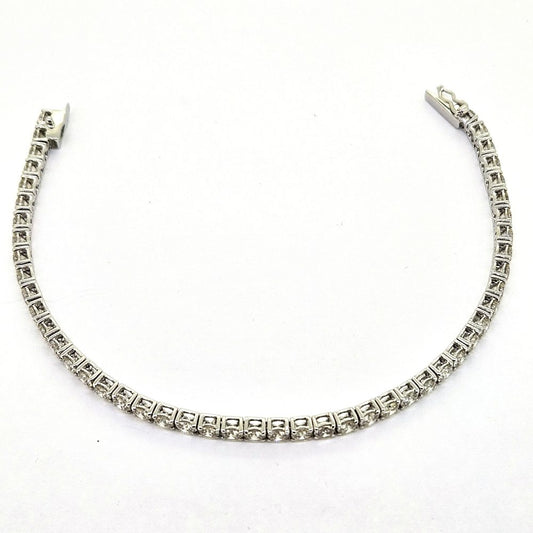 7.56ct Diamond Line Bracelet in 18ct Gold, timeless diamond tennis bracelet 7.56 carats round brilliant-cut diamonds claw set in articulated settings in 18ct white gold