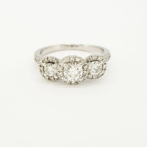 Three Stone Diamond Cluster Ring in 18ct White Gold, 1.00 carat total, featuring three brilliant cut diamonds all within diamond surrounds and diamond set shoulders