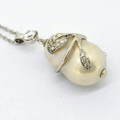 Southsea Pearl and Diamond Pendant with Chain, cultured South Sea pearl with 18ct white gold leaf wrap around design set with sparkling diamonds