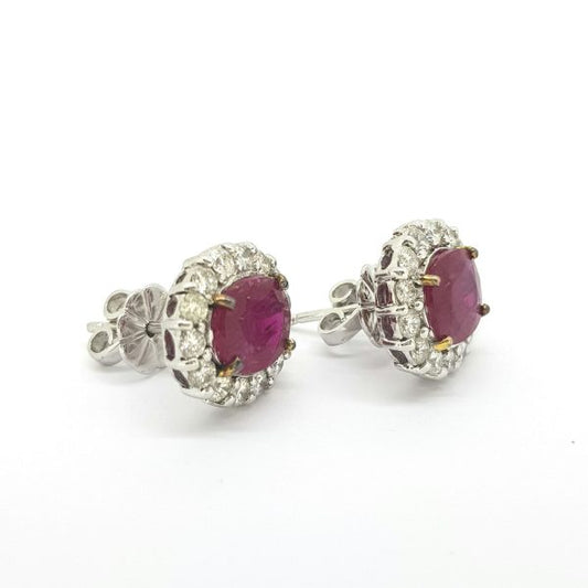 Ruby and Diamond Oval Cluster Stud Earrings; featuring 4.65cts oval faceted rubies surrounded by 1.48cts diamonds, in 18ct white gold