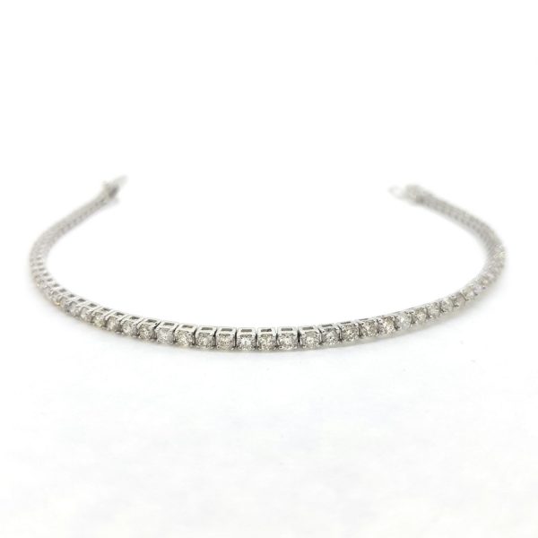 Diamond Line Tennis Bracelet; set with 2.95 carats of round brilliant-cut diamonds, claw-set and mounted in 18ct white gold