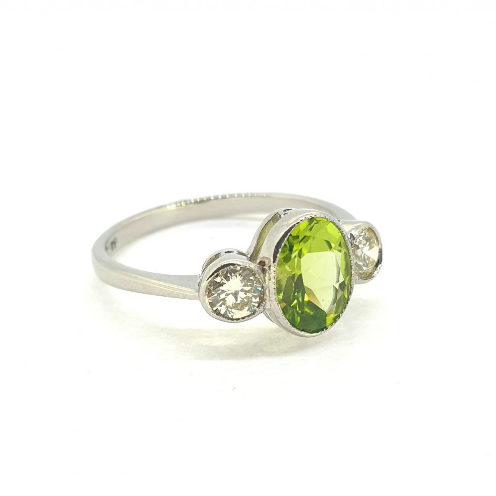 1.25ct Oval Peridot and Diamond Three Stone Ring