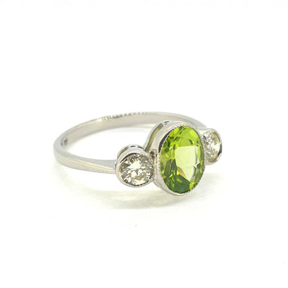 1.25ct Oval Peridot and Diamond Three Stone Ring