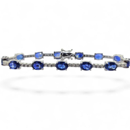 13.8ct Oval Sapphire and Diamond Line Bracelet, comprising 13 oval sapphires and 39 round diamonds in 18ct white gold