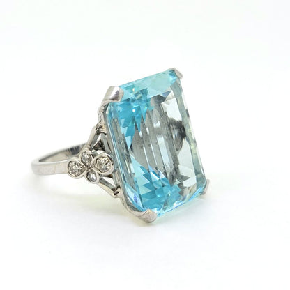 30ct Emerald Cut Aquamarine Cocktail Ring with Diamonds, large 30ct emerald-shaped step-cut aquamarine accented with sparkling diamonds to the shoulders in 18ct white gold