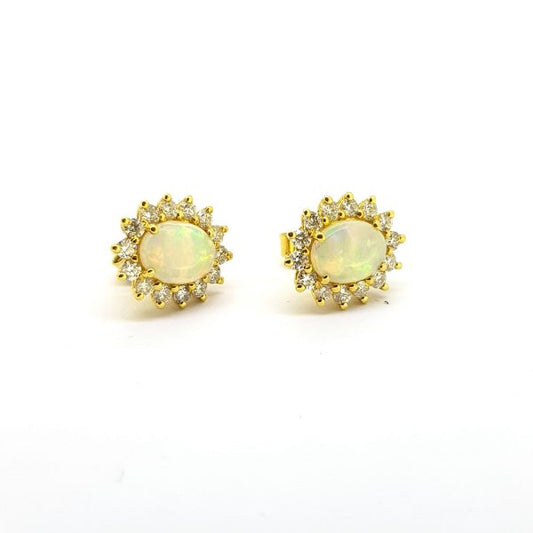 Opal and Diamond Oval Cluster Stud Earrings; featuring 1.15cts oval cabochon-cut opals surrounded by 0.71cts sparkling brilliant-cut diamonds, in 18ct yellow gold