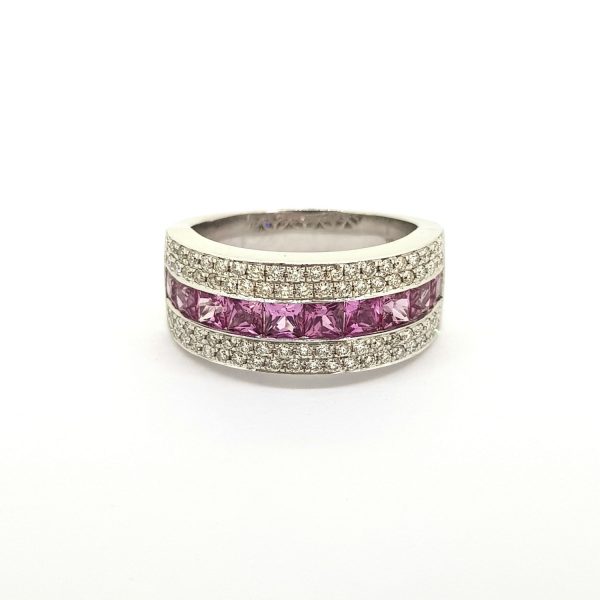 Princess Cut Pink Sapphire and Diamond Set Band Ring; central row of princess-cut pink sapphires flanked top and bottom by two rows of brilliant-cut diamonds, in 18ct white gold