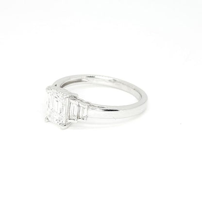 Emerald Cut Diamond Engagement Ring, central GIA certified 1.01 carat emerald-cut diamond flanked by graduated baguette-cut diamonds, in 18ct white gold, colour E clarity VS1