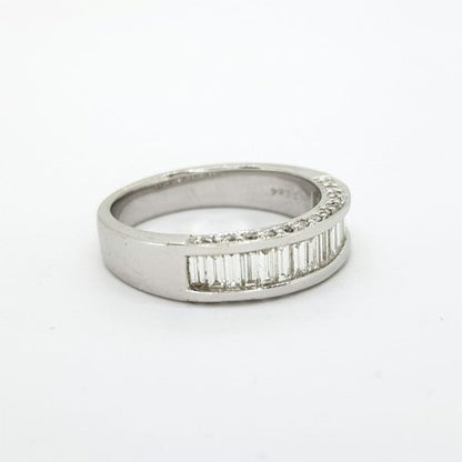 Channel Set Baguette Cut Diamond Half Eternity Ring, 0.84 carat total, accented with brilliant cut diamonds to the sides of the mount, in 18ct white gold