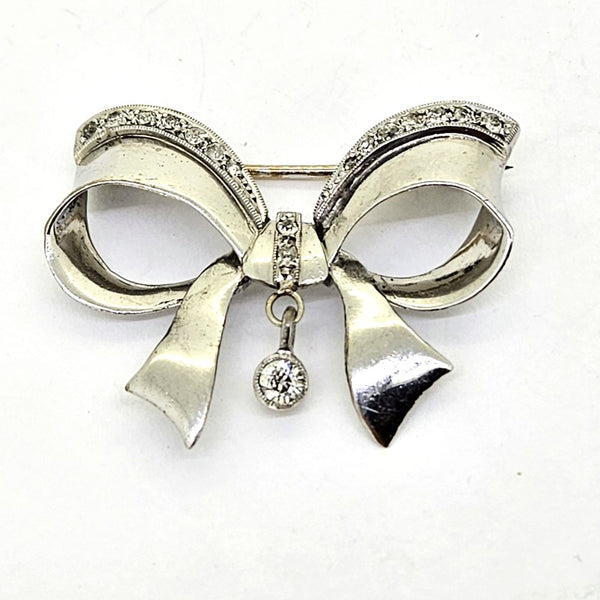 Diamond Set 18ct Gold Bow Brooch, 18ct white gold brooch in the form of a bow, accented with sparkling diamonds