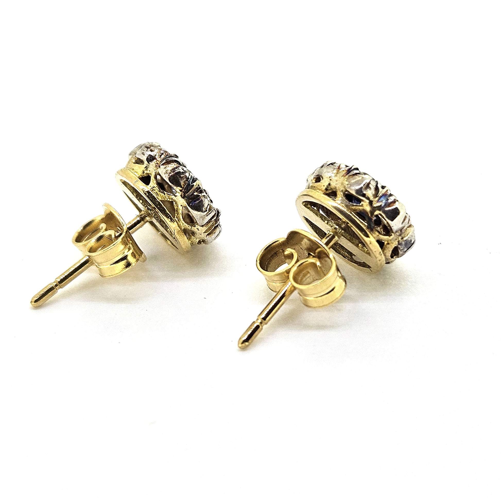 Sapphire and diamond cluster stud earrings in silver and 18ct yellow gold, viewed from behind, on a white background