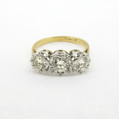 Vintage Diamond Three Stone Ring, 1.00 carat total, featuring three illusion set brilliant-cut diamonds, on a plain 18ct yellow gold shank, Circa 1970s