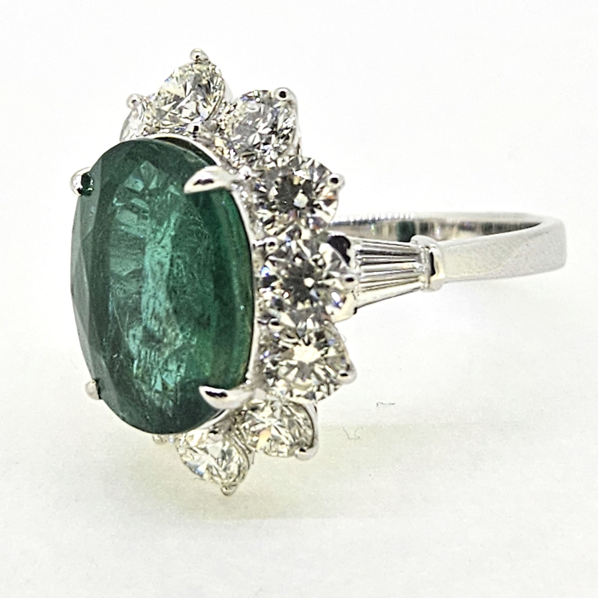 6.61ct Oval Emerald and Diamond Cluster Engagement Ring in 18ct Gold