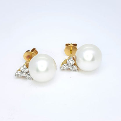 South Sea Pearl and Trefoil Diamond Stud Earrings; 12.5mm white South Sea pearls suspended from 1.20cts trefoil diamond studs, in 18ct yellow gold