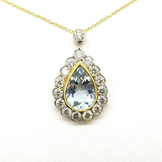 Aquamarine and Diamond Pear Shaped Cluster Pendant; 3.25ct pear-cut aquamarine within diamond surround and suspended from a diamond-set bale, in 18ct yellow and white gold