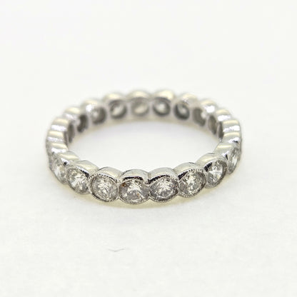 A diamond full eternity ring in 18ct white gold, on a white background