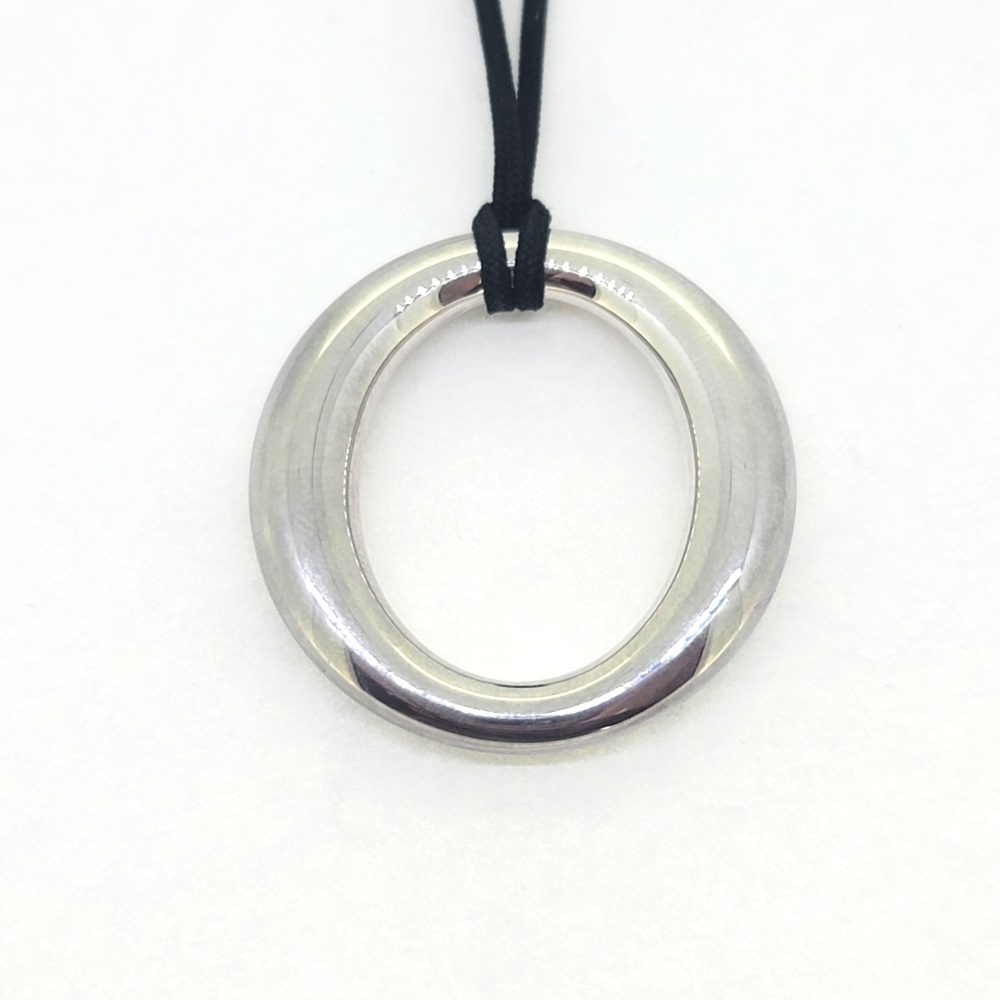Vintage Tiffany and Co Sevillana Silver Pendant, open circle oval pendant suspended on a black cord 925 silver