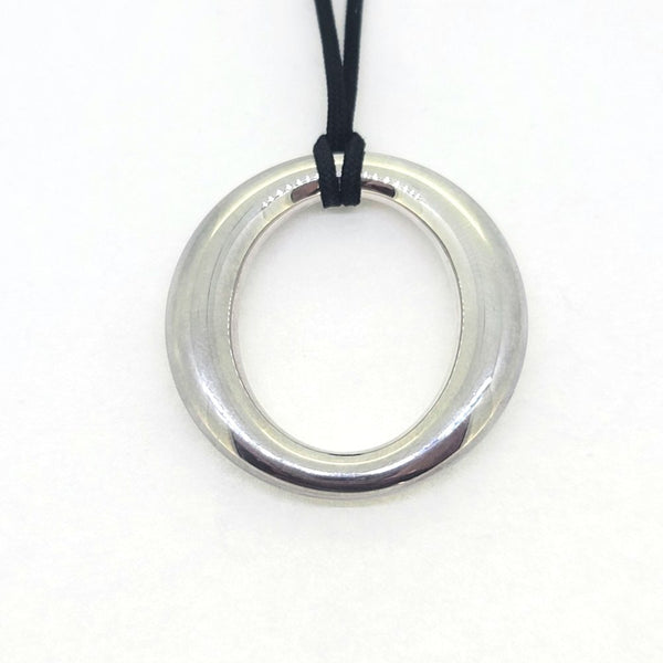 Vintage Tiffany and Co Sevillana Silver Pendant, open circle oval pendant suspended on a black cord 925 silver