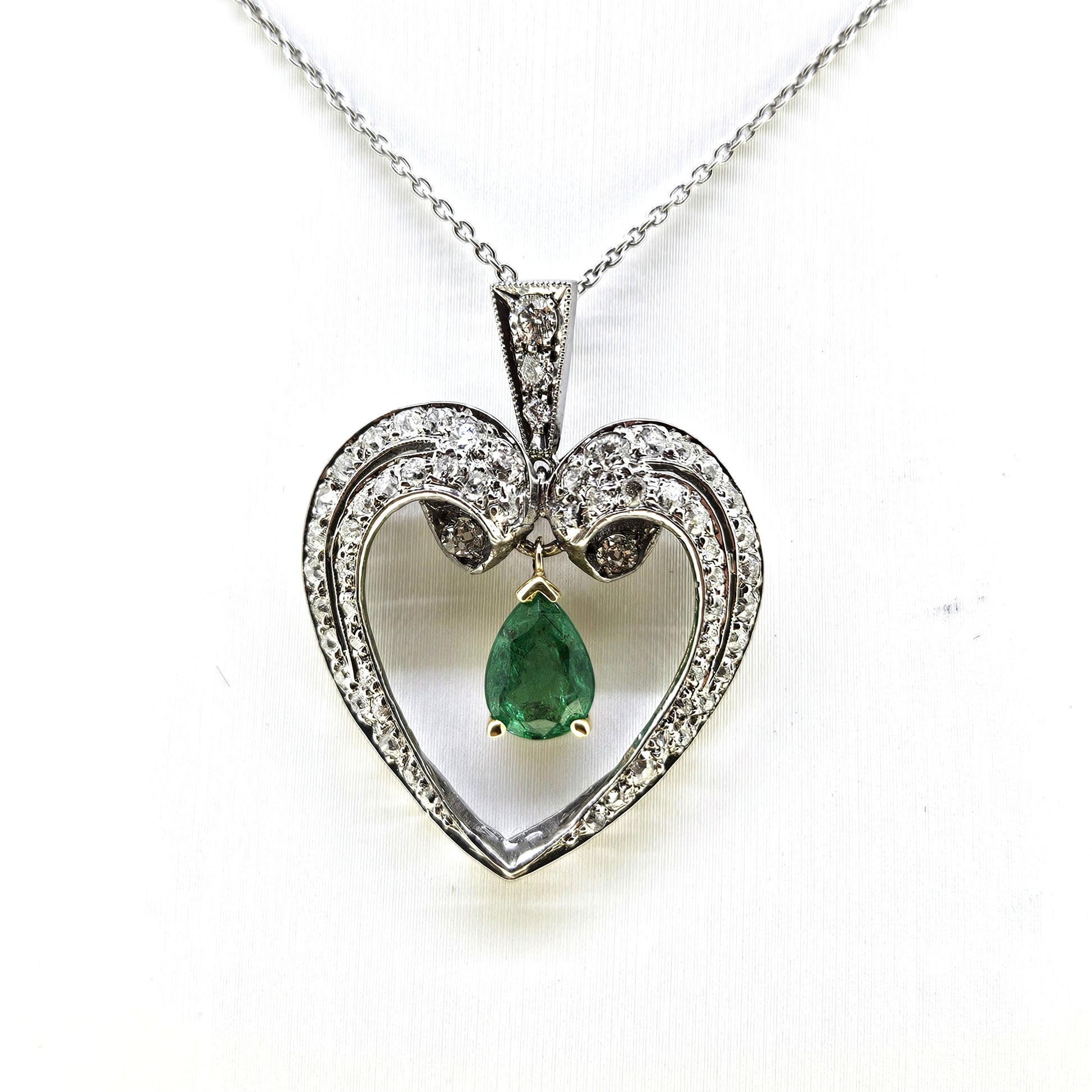 Pear Cut Emerald and Diamond Heart Shaped Pendant in Platinum